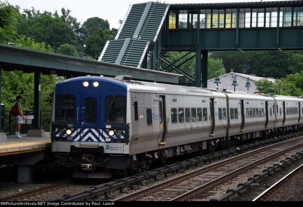 Inbound commuter approaches its stop